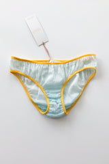 Light blue underwear with yellow trim on a white background