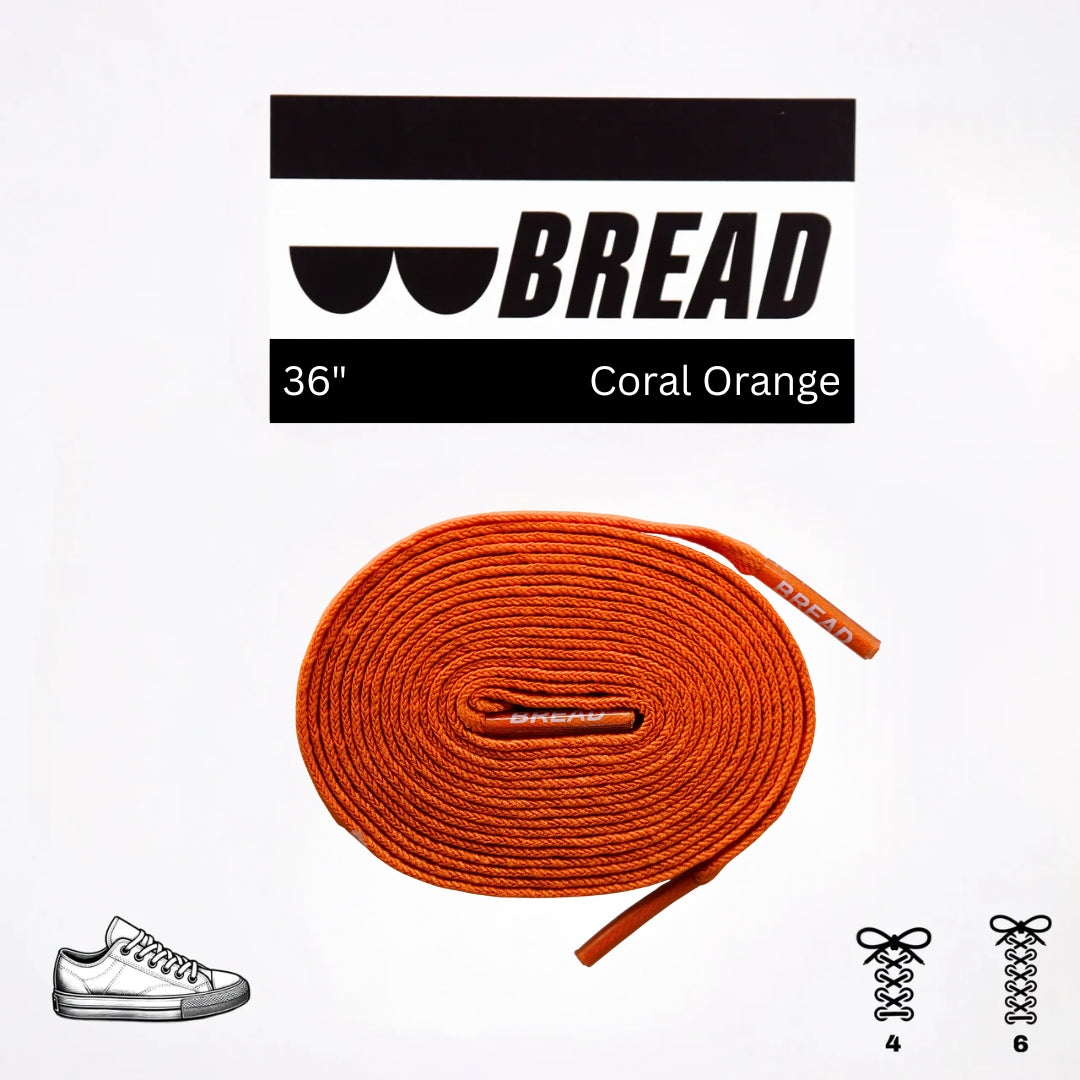Orange shoelace with 'BREAD' branding on a white background