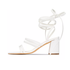 White sandal with ankle strap on a white background