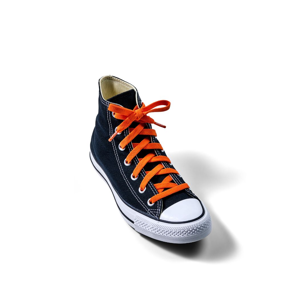 Navy high-top sneaker with orange laces on a white background