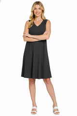 Woman wearing a black sleeveless dress on a white background