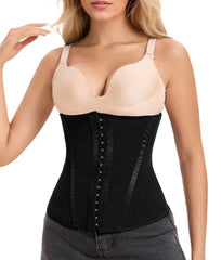 Woman wearing a black waist trainer with beige top on a white background