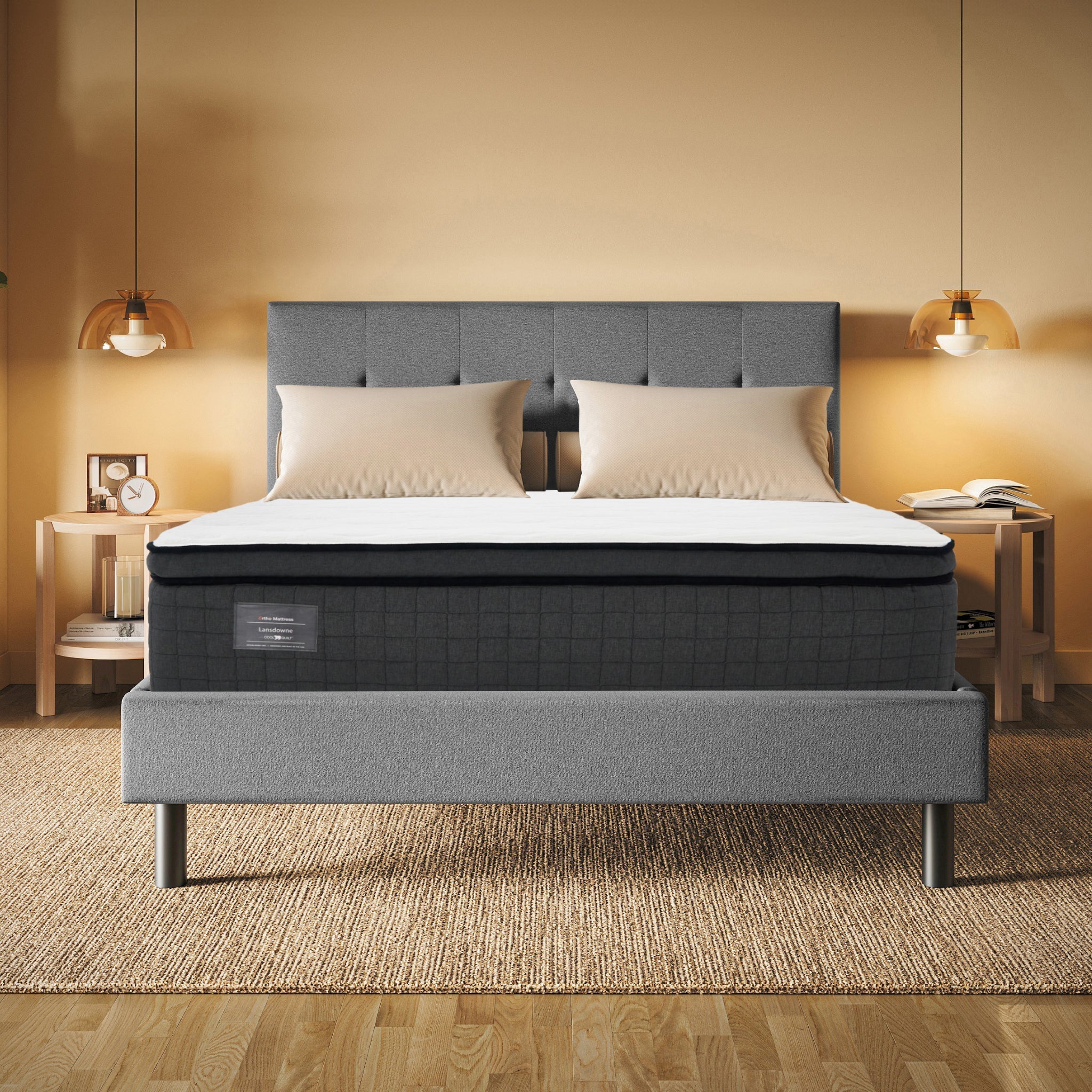 Gray upholstered bed with white mattress in a bedroom setting