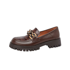 Brown leather loafer with chunky sole on a white background