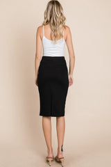 Woman wearing a white tank top and black pencil skirt on a beige background