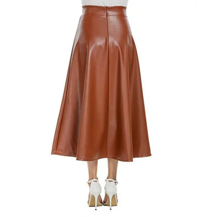 A person wearing a high-waisted brown PU leather long skirt with a flared design, paired with heels.