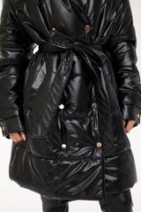 Black puffer coat with a belt on a white background