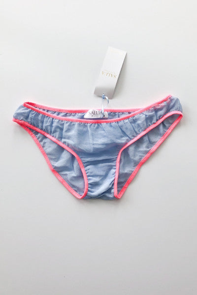 Blue patterned underwear with pink trim on a gray background