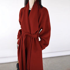 Red coat worn by a person on a white background
