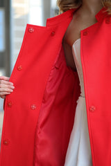 Red coat with a blurred background
