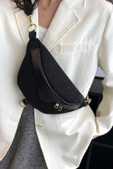 Person wearing a black waist bag with a white blazer