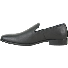 Black slip-on shoe on a white background