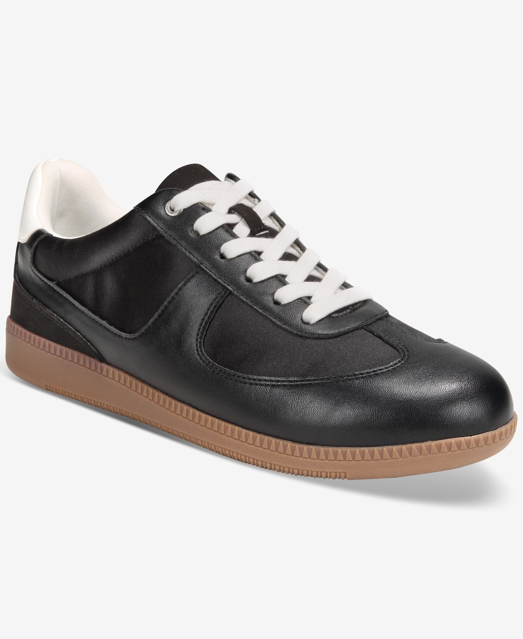 Black leather sneaker with white laces and brown sole on a white background