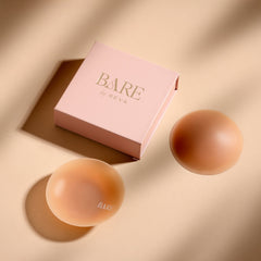 Two makeup products and their packaging with 'Bare' branding on a beige background