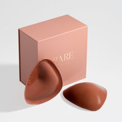 Bare Beauty product packaging with two brown silicone shields on a light gray background