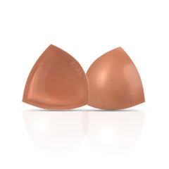 Pair of brown silicone bra cups on a white background
