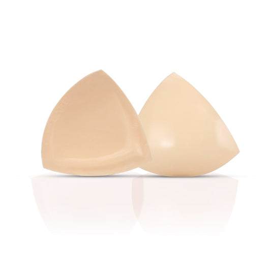 Beige silicone bra on a white background