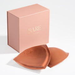 Bare Beauty product packaging with two rose gold discs on a white background