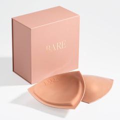 Bare brand silicone pads with packaging on a light gray background