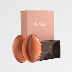 Two terracotta-colored silicone products with a 'BARE' branded box on a light gray background.