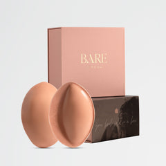 Two peach-colored circular objects with a 'BARE' branded box on a light gray background