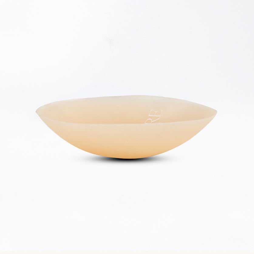 Beige ceramic bowl on a white background