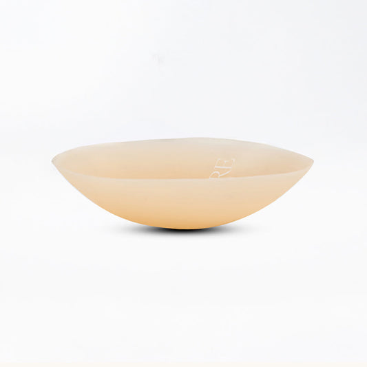 Beige ceramic bowl on a white background