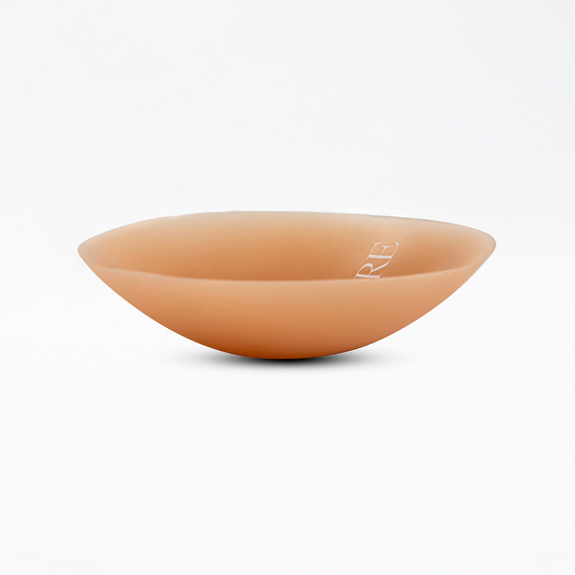 Ceramic bowl with a smooth, curved design on a white background