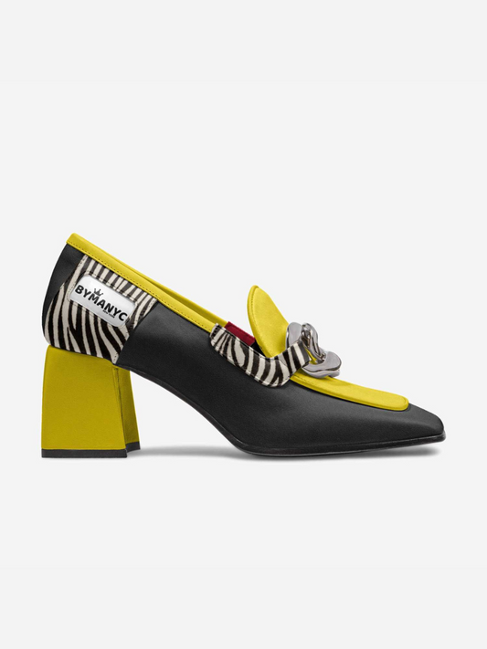 Black high-heeled shoe with yellow accents and zebra pattern, featuring a brand logo.
