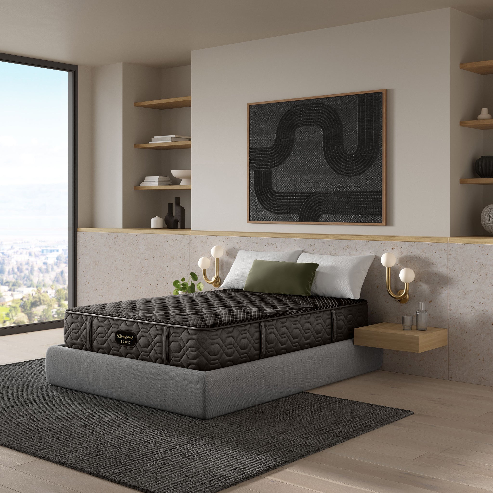 Gray mattress on a bed in a modern bedroom with shelves and artwork.
