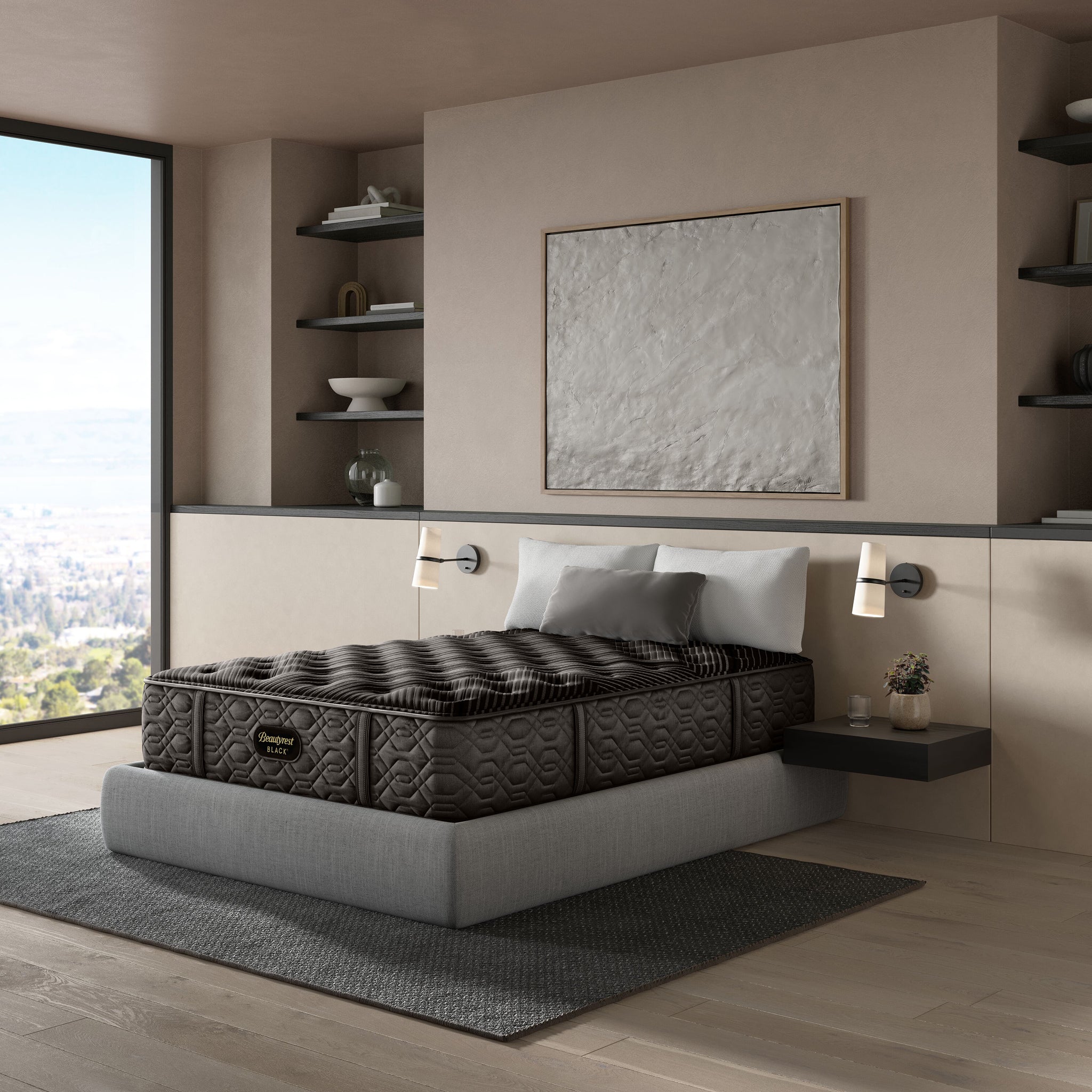 Mattress on a bed in a modern bedroom with large windows and shelves.