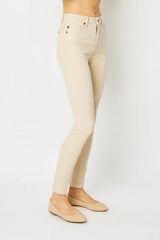 Beige jeans worn by a person on a white background