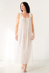 Woman wearing a white nightgown on a white background