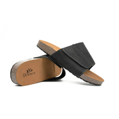 Black sandal with brown sole on a white background