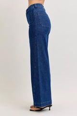 Blue jeans worn by a person on a white background
