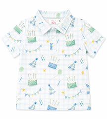 Children's short-sleeve shirt with birthday-themed pattern on a white background
