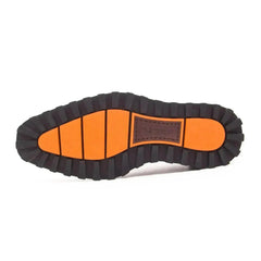 Shoe sole with orange and black design on a white background