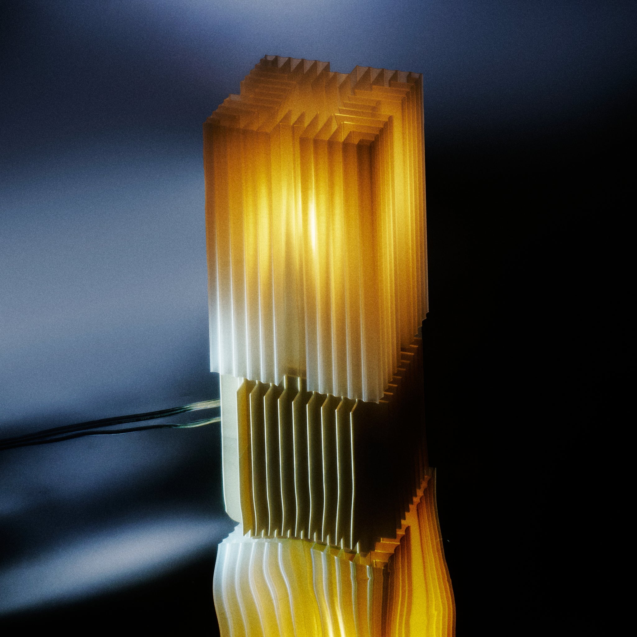 Modern lamp with geometric design on a reflective surface