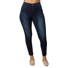 Dark blue jeans worn by a person on a white background