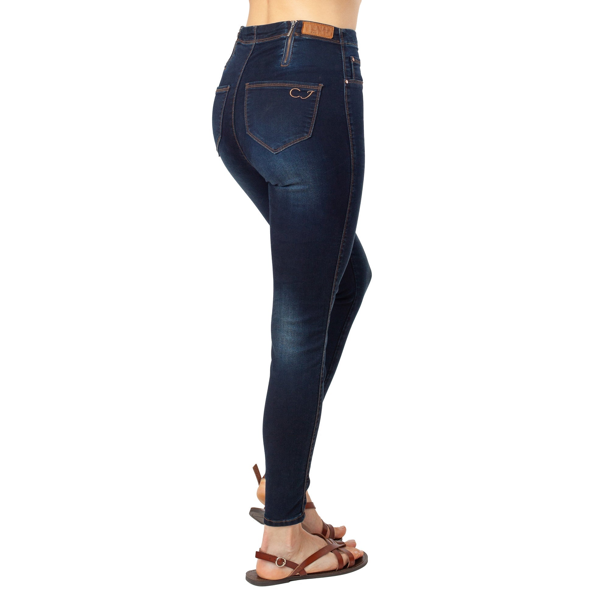 Dark blue jeans worn by a person on a white background