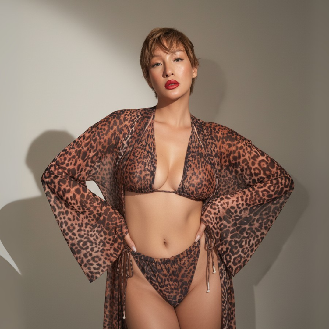 Person wearing a leopard print bikini and cover-up against a neutral background