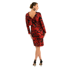 Red and black patterned dress on a model against a white background