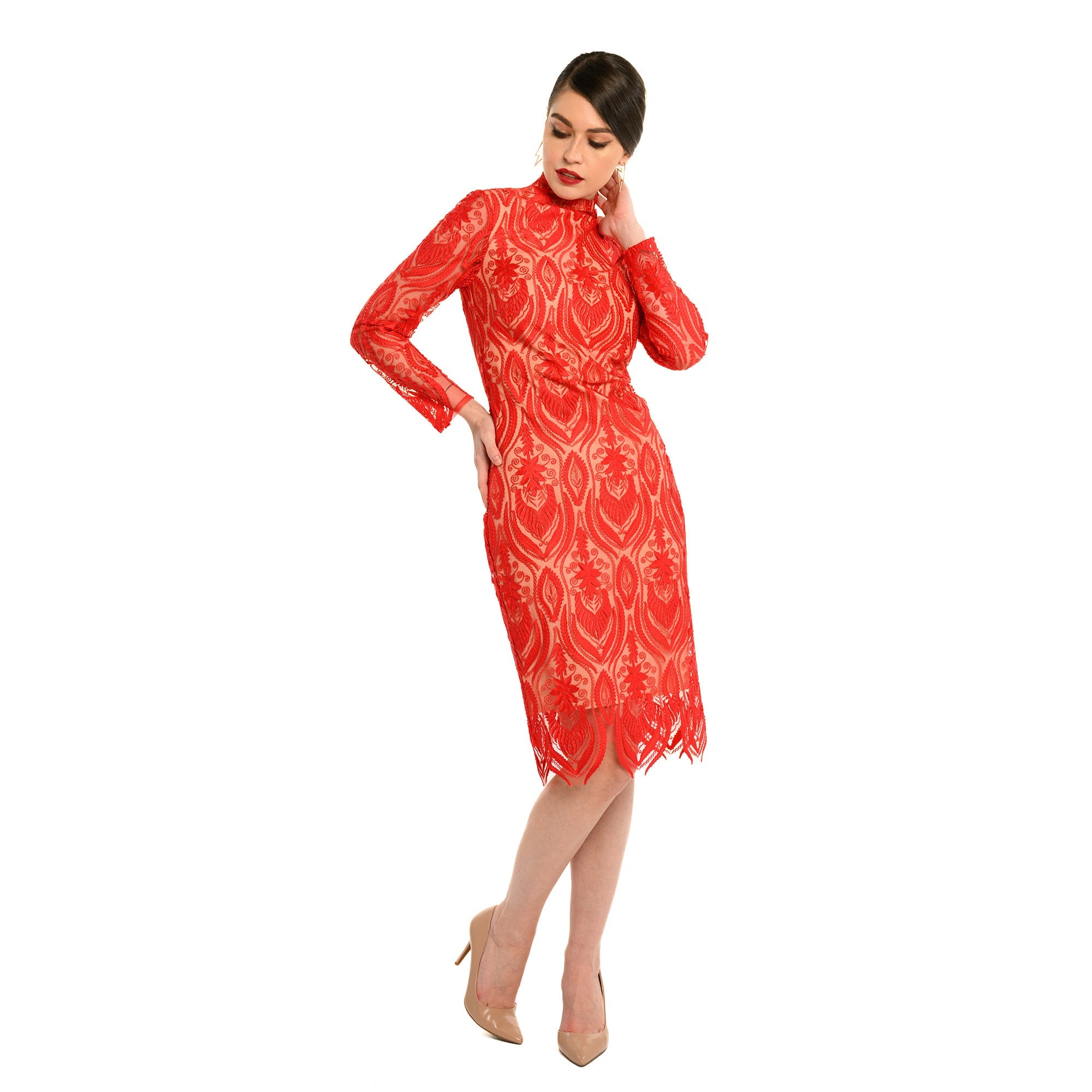 Woman wearing a red patterned dress on a white background