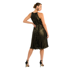 Woman wearing a black and gold dress on a white background
