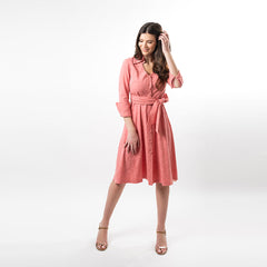 Woman wearing a pink dress on a white background
