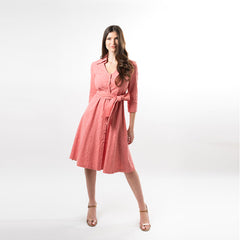 Woman wearing a pink dress on a white background