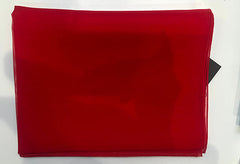 Red fabric with a black tag on a white background