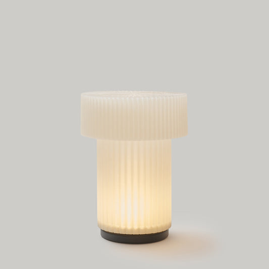 White textured table lamp on a gray background