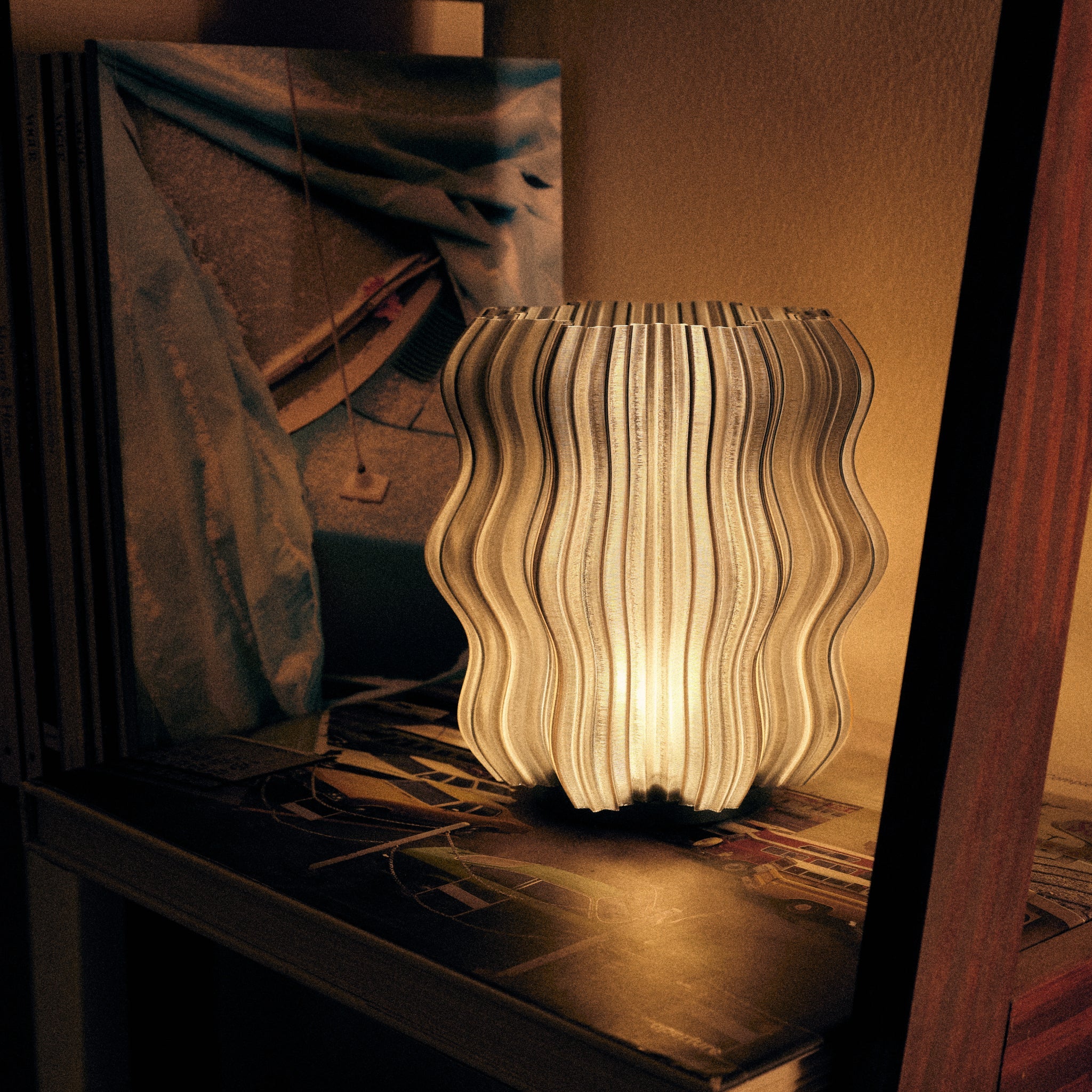 Wavy-patterned lamp on a dark surface with a blurred background