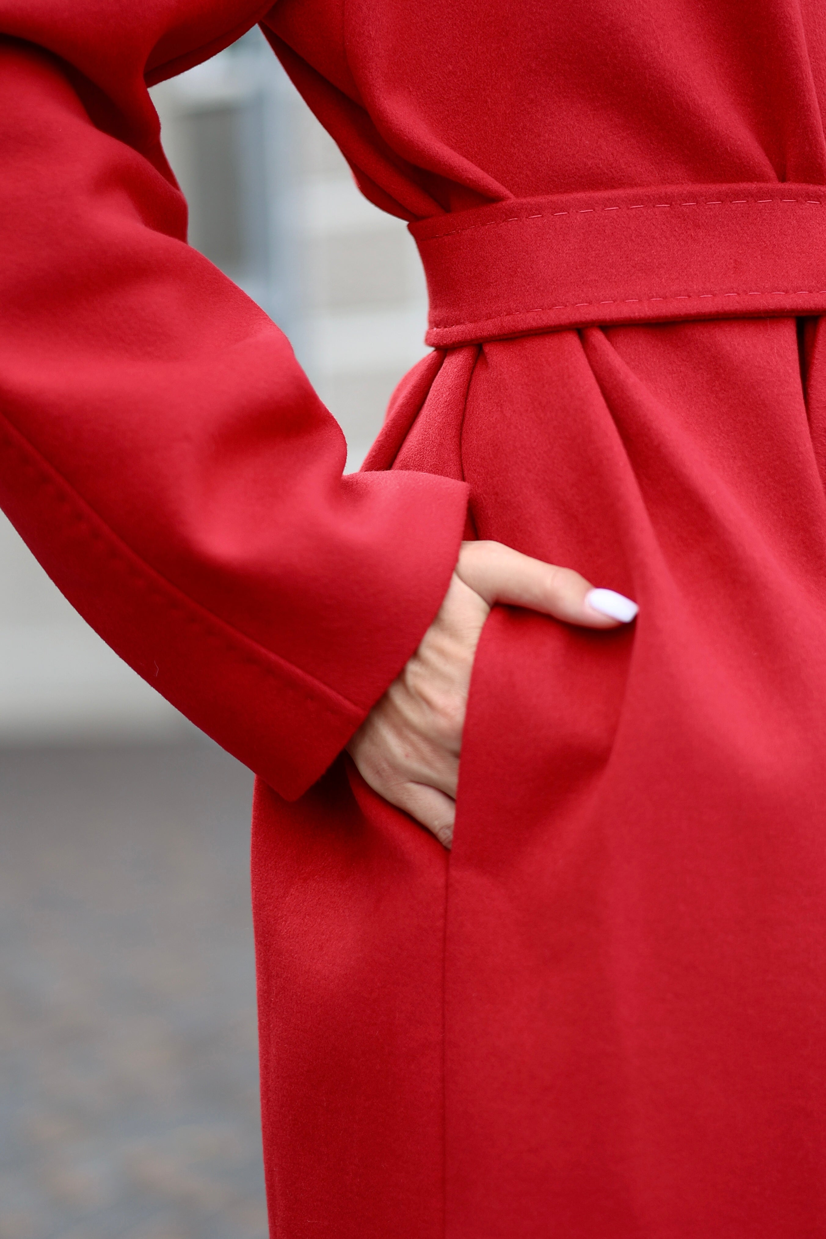 Red coat with a blurred background